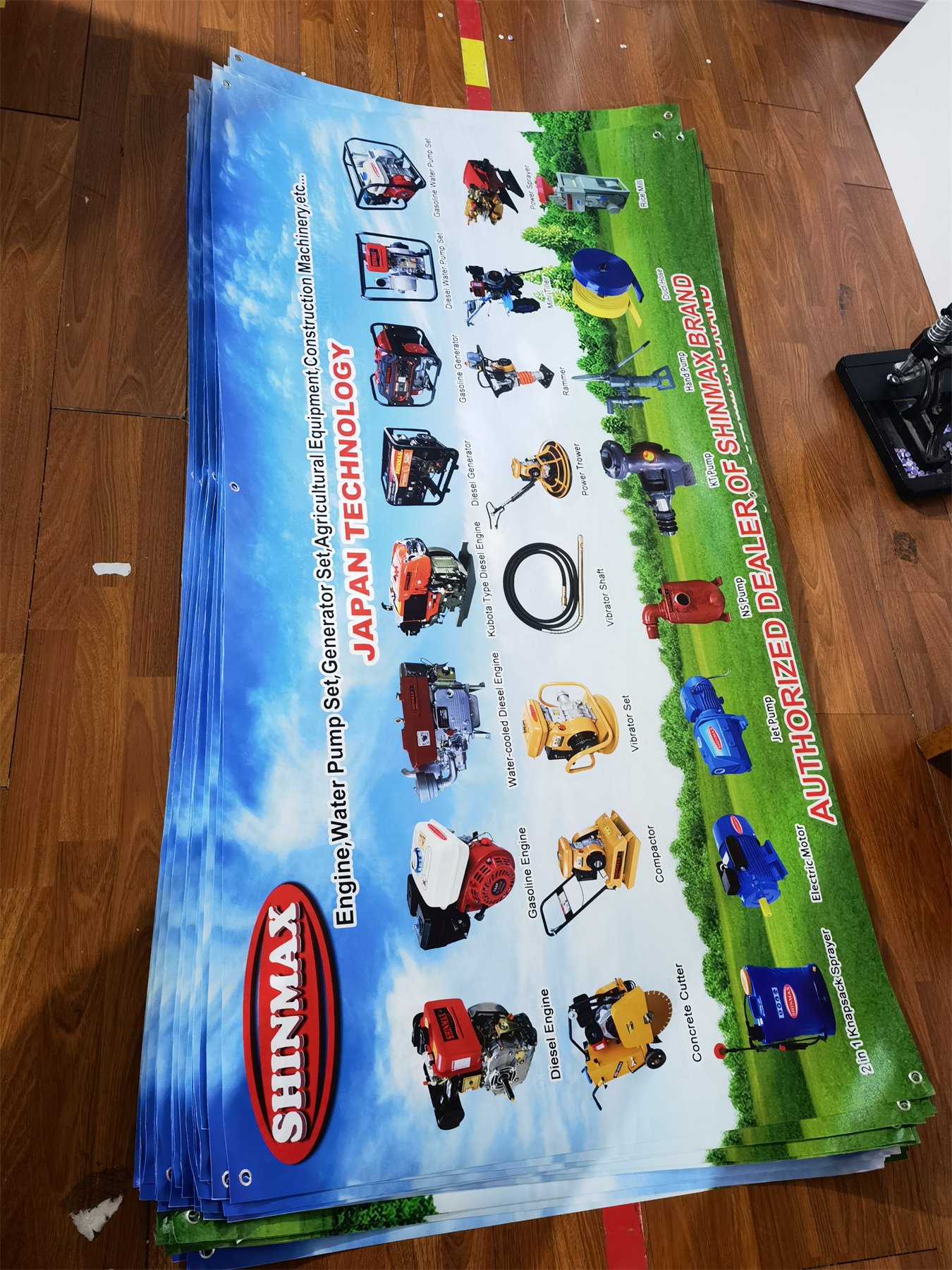 Finished custom vinyl banners with grommets in bulk production